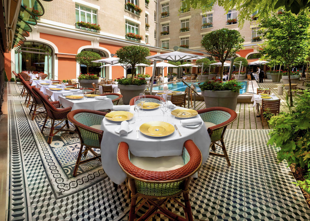 a table set up for a meal outside of a building