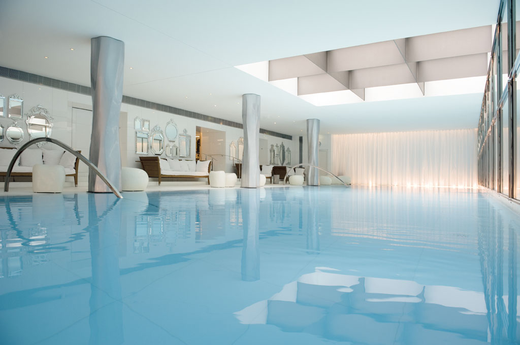 a swimming pool with a large white room