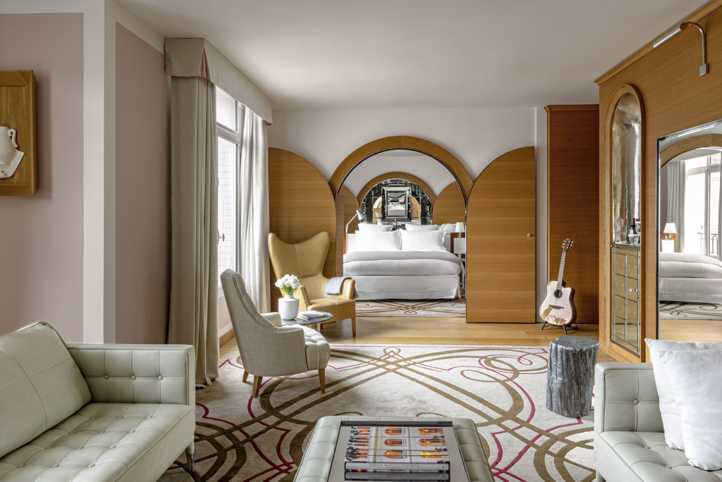 a room with a bed and a guitar