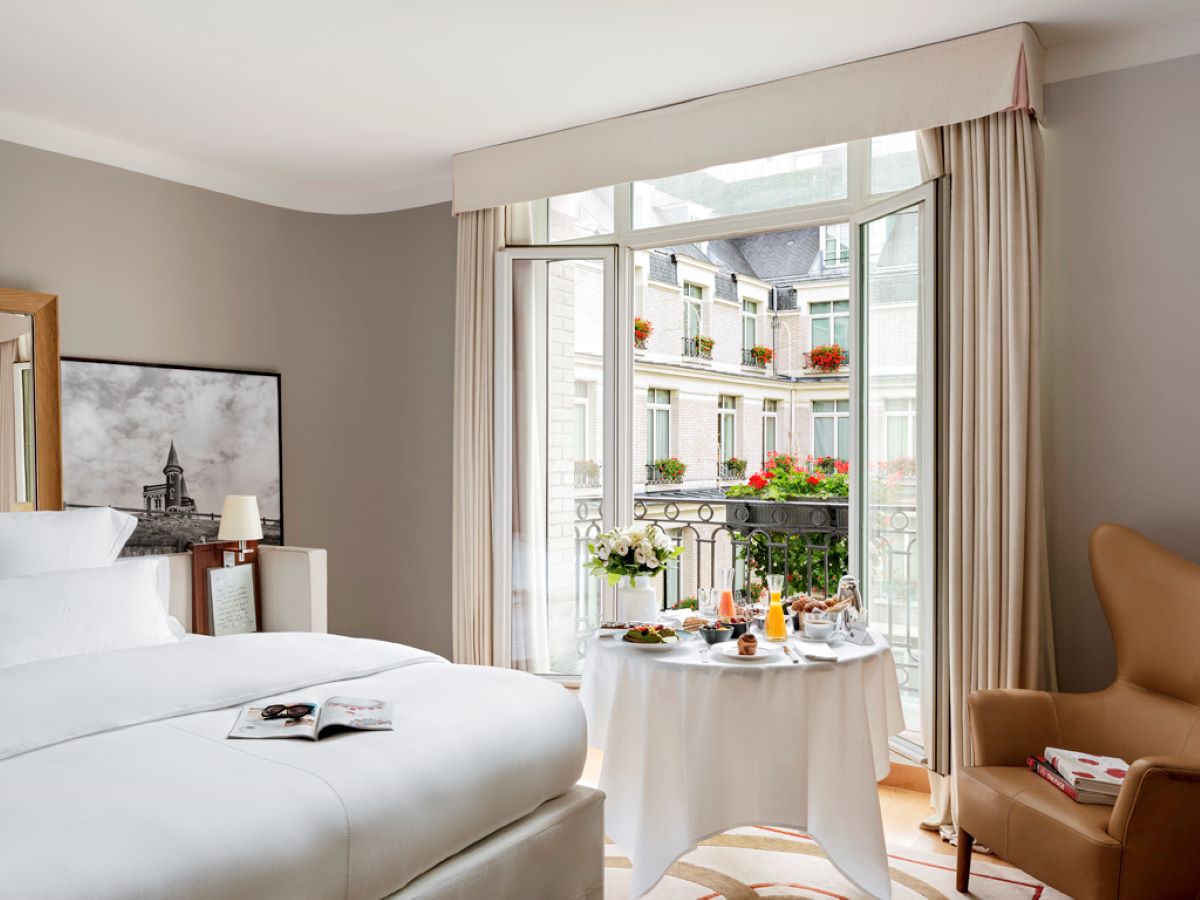 a room with a bed and a table with food on it