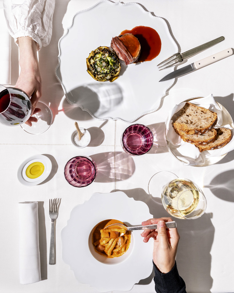 a person eating food on a table