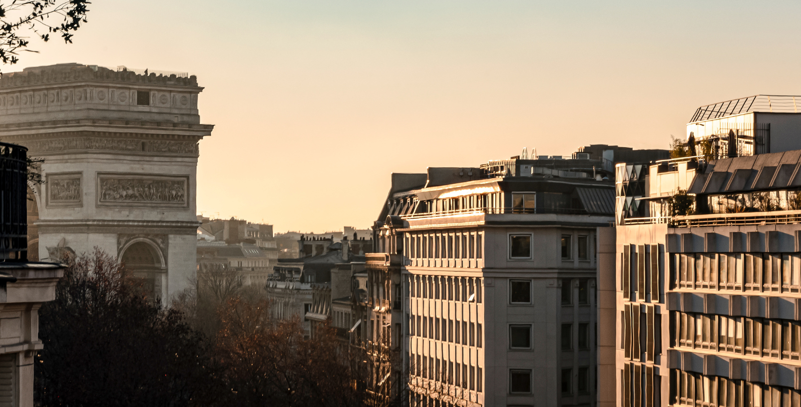 a tall building with a tower in the background