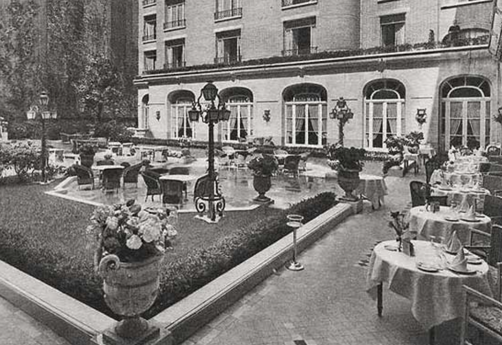 a courtyard with tables and chairs