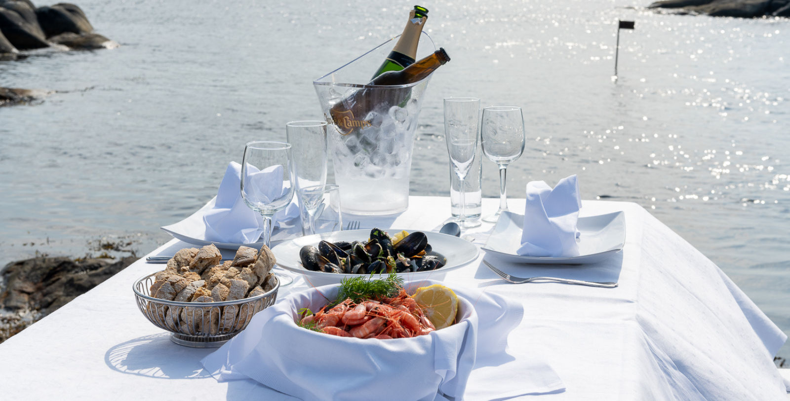 a table with food and wine glasses on it