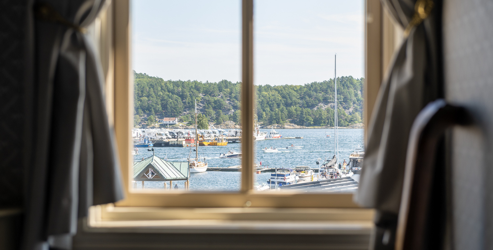 a view of boats and a harbor from a window