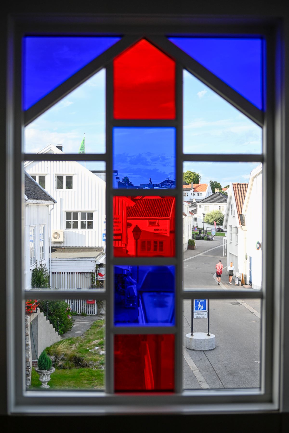 a window with a red and blue glass
