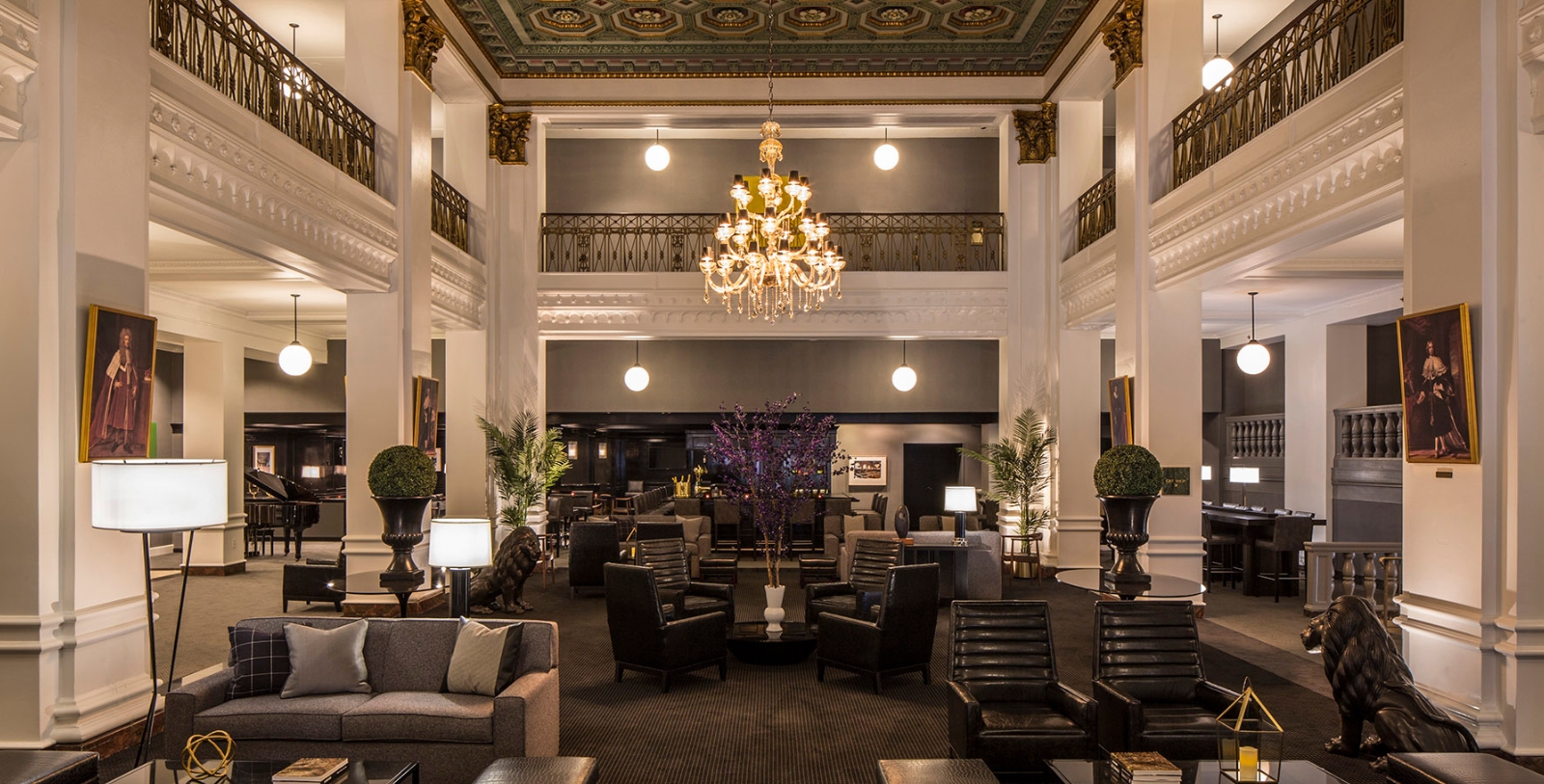 a large room with chairs and a chandelier