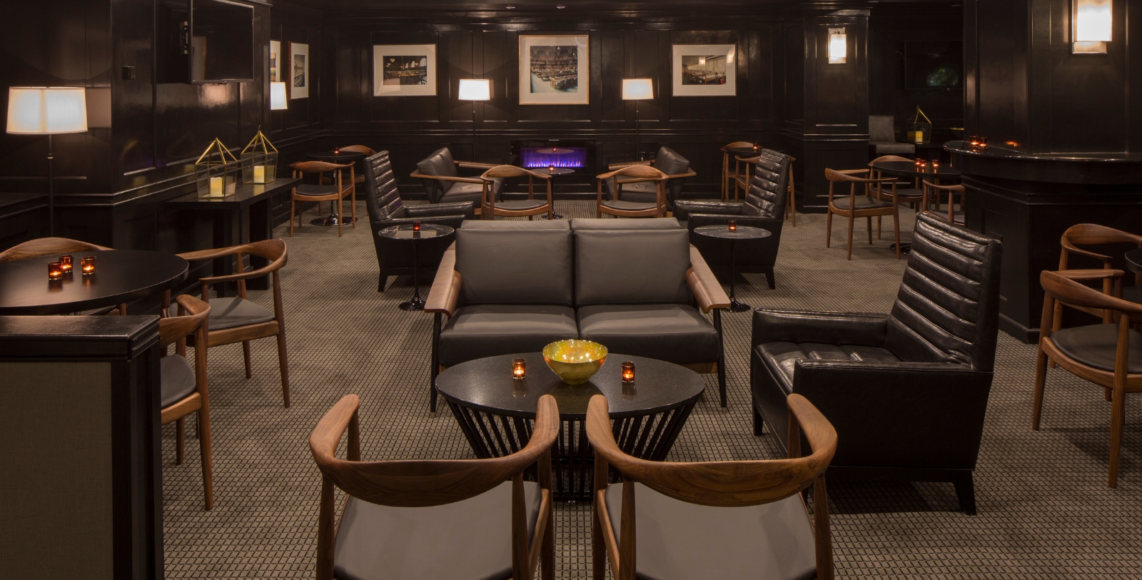 a room with black furniture and a table