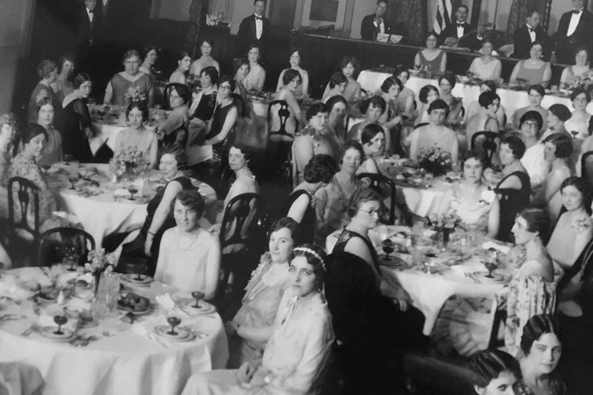 a group of people sitting at tables