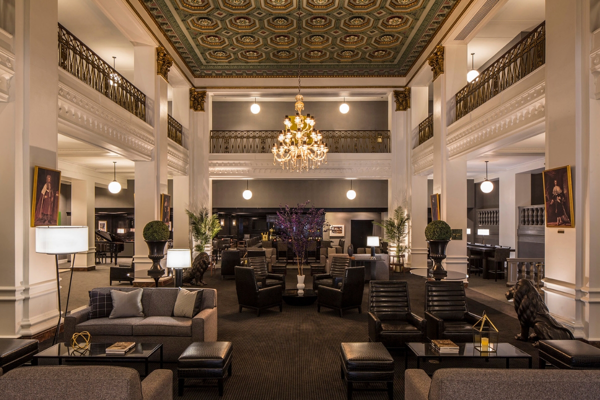 a large room with a chandelier and chairs