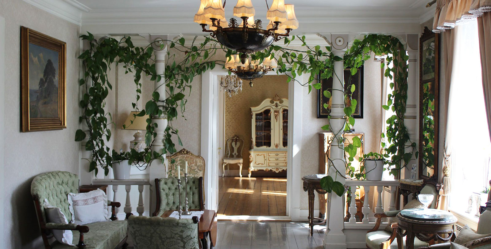 a room with a chandelier and a table