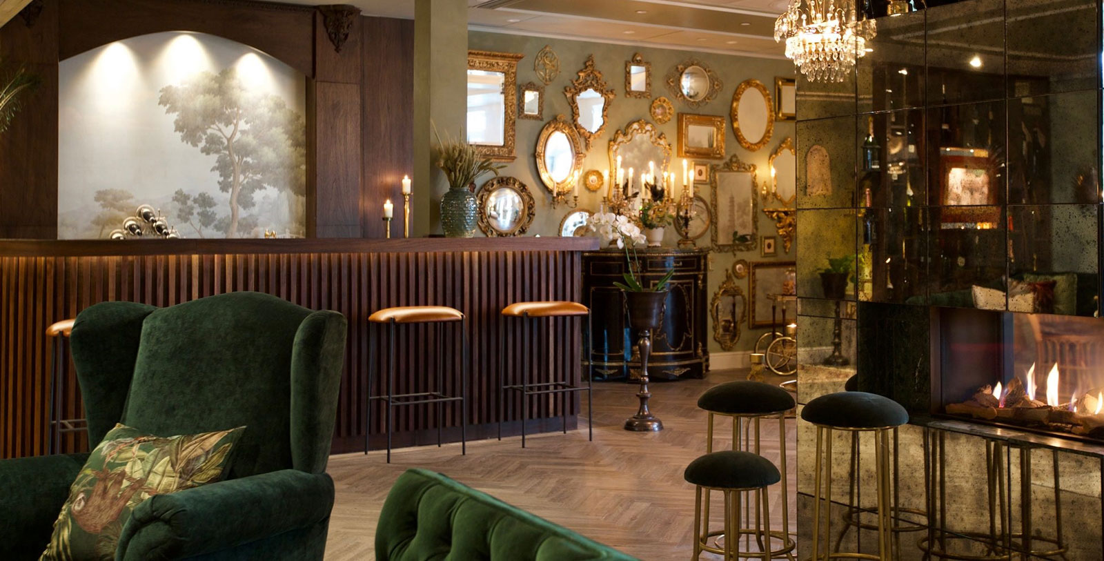 a room with a bar counter and mirrors