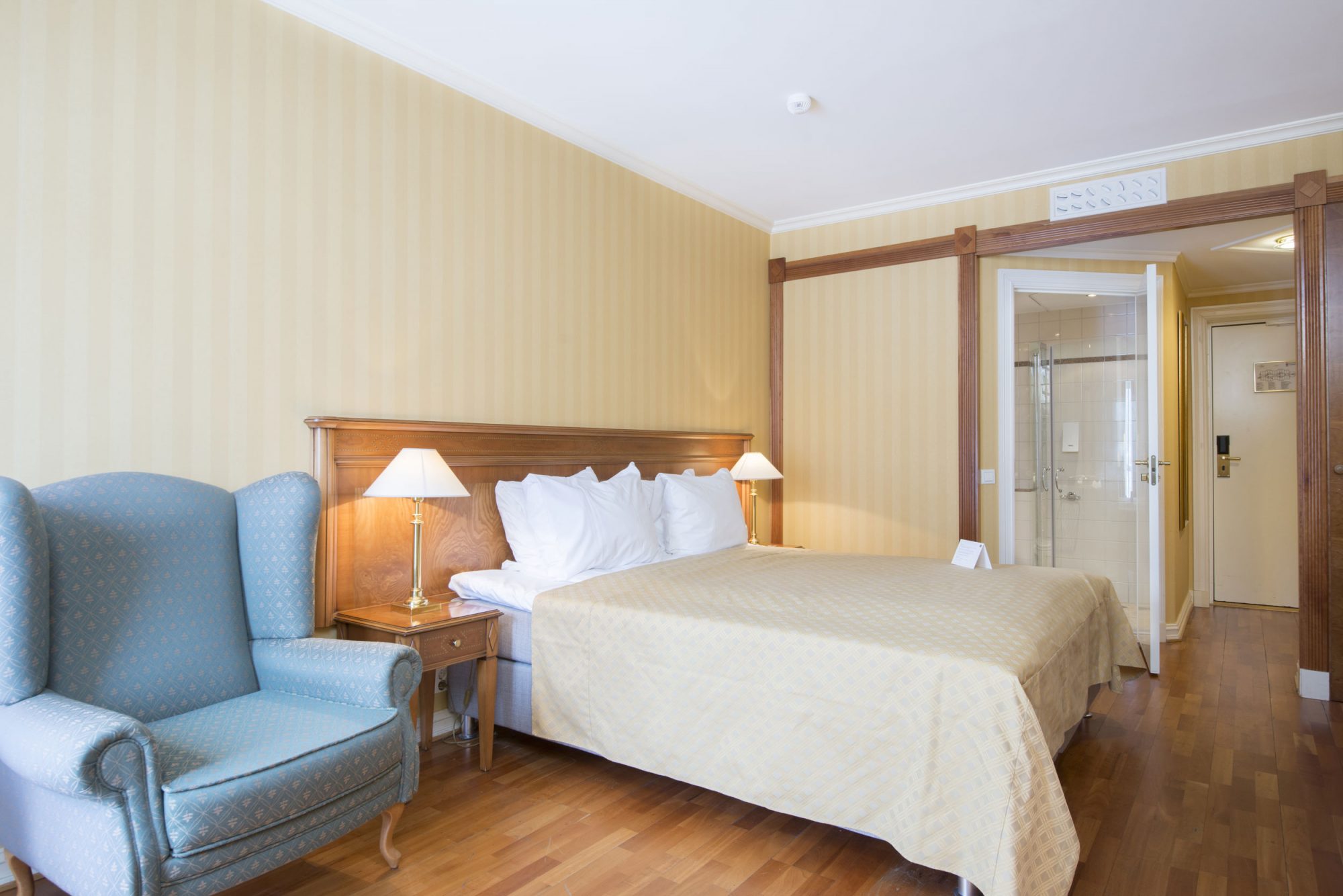 a room with a bed and a chair