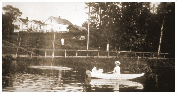 a woman in a boat with dogs on the water