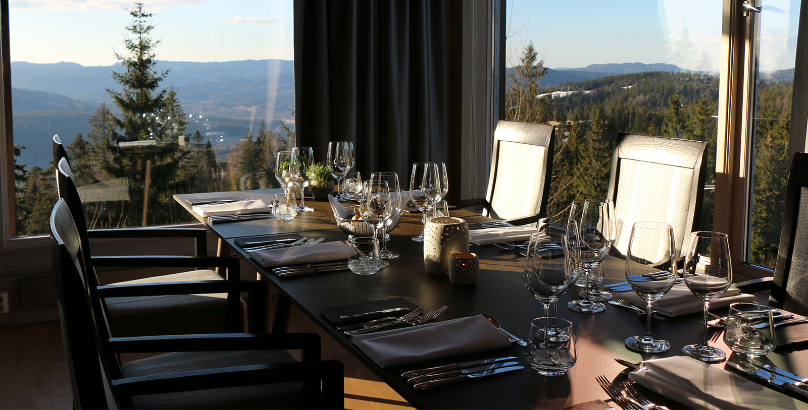 a table with glasses and utensils on it