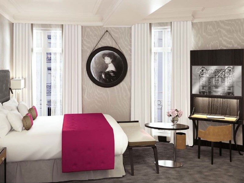 a room with a bed and a desk