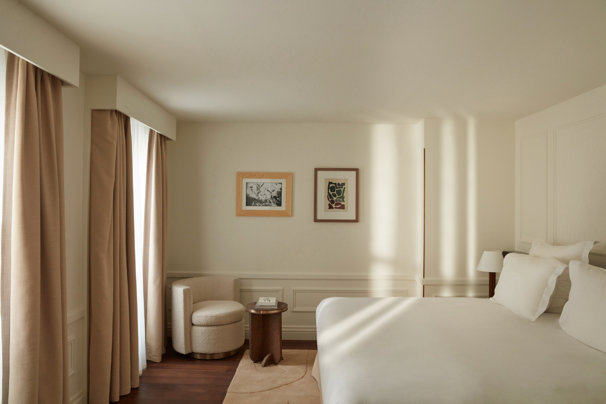a room with a bed and a chair