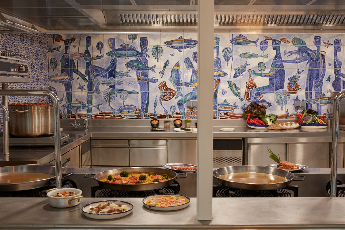 a kitchen with many pans of food