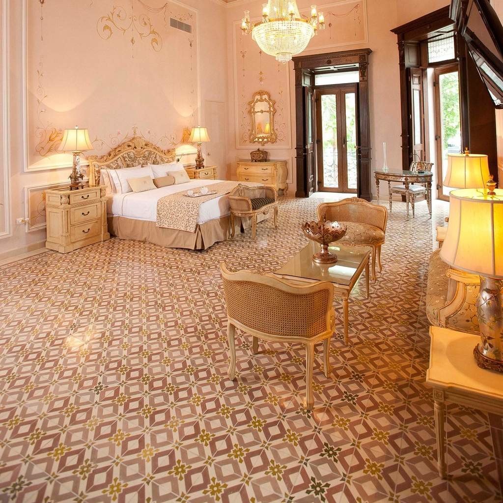a bedroom with a bed and chairs