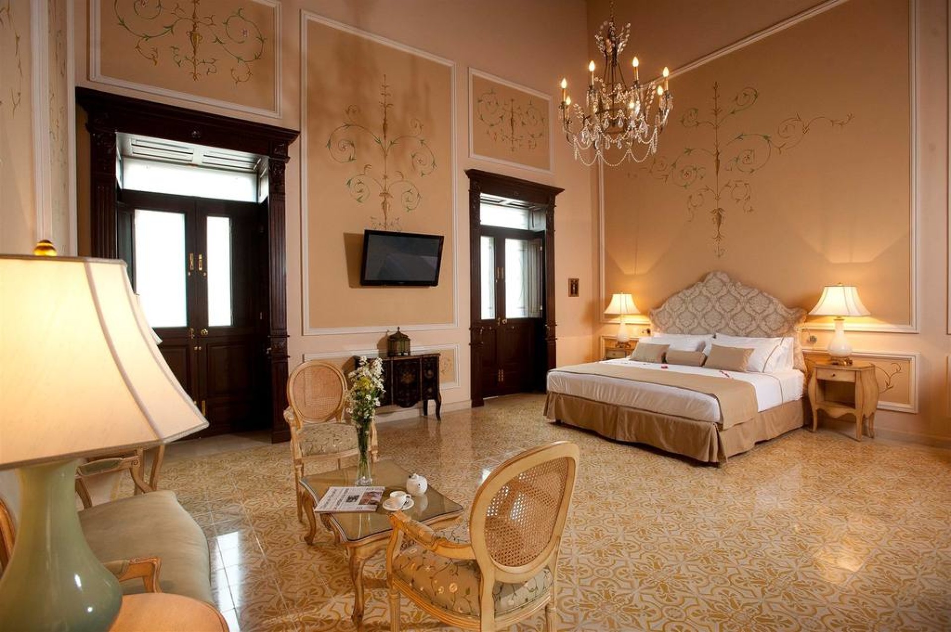 a room with a bed and a chandelier