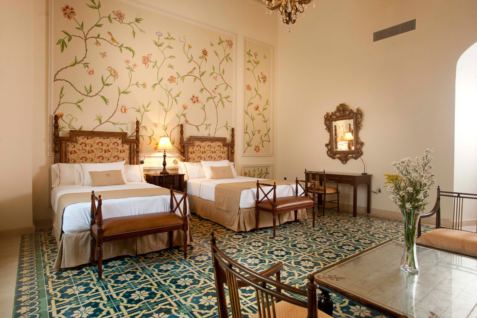 a room with two beds and a table