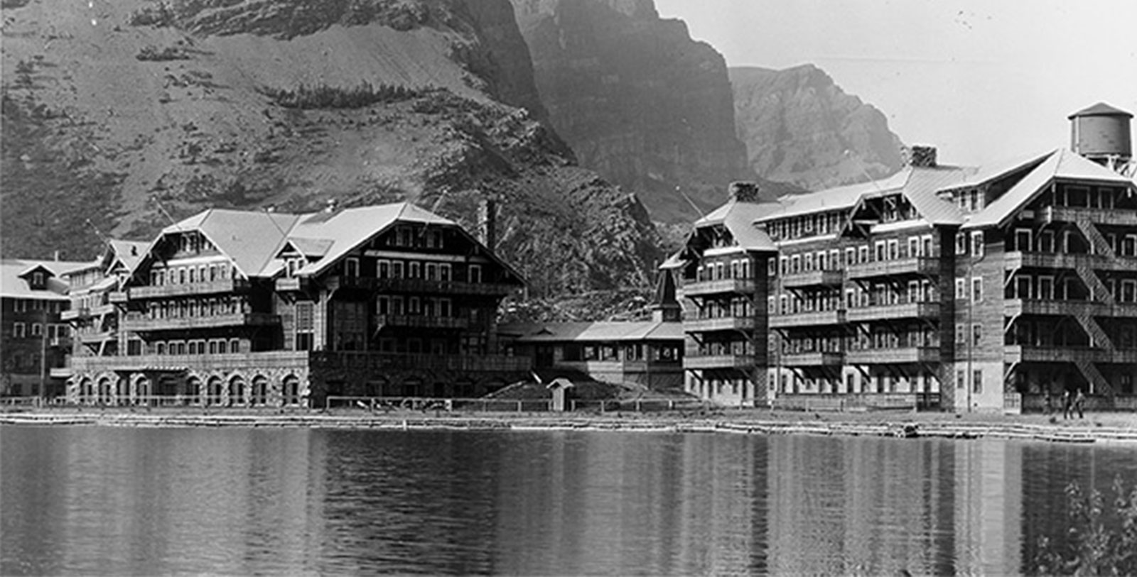 a group of buildings next to a body of water