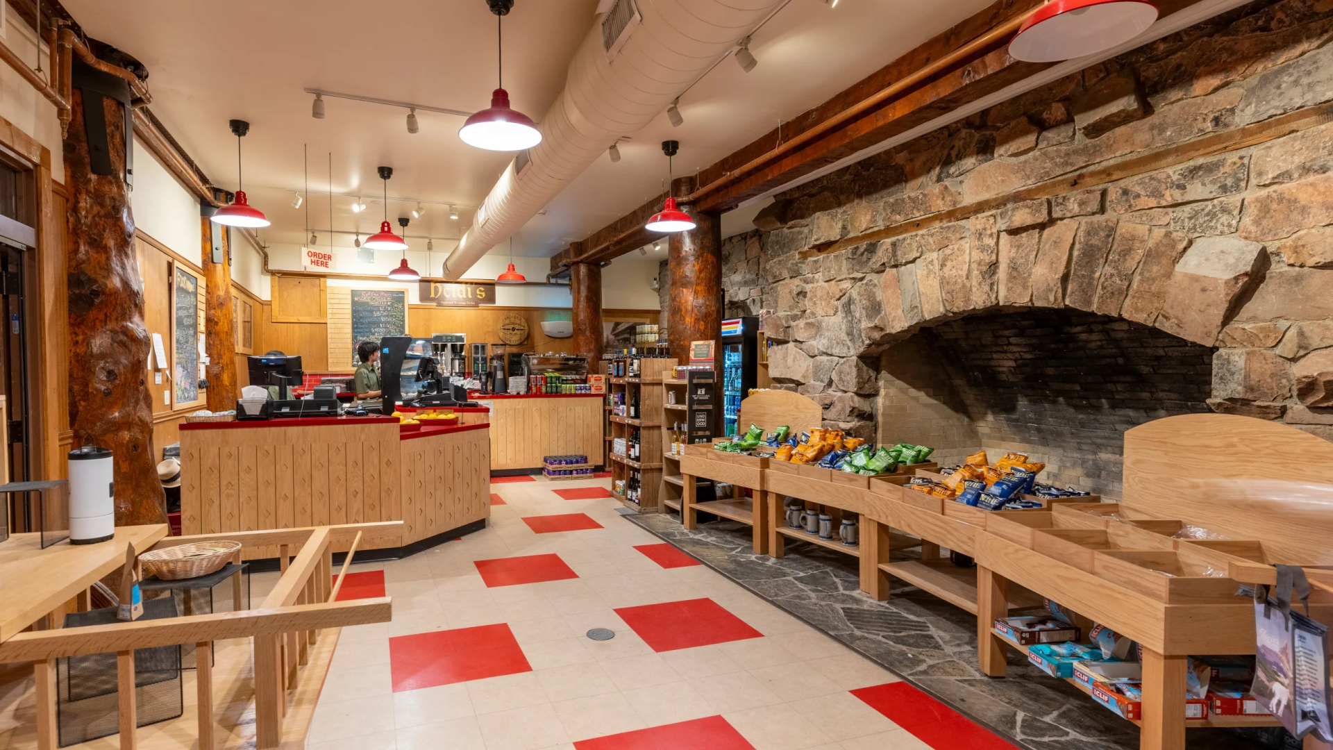 a store with a stone fireplace and shelves
