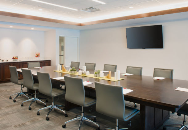 a conference room with a table and chairs
