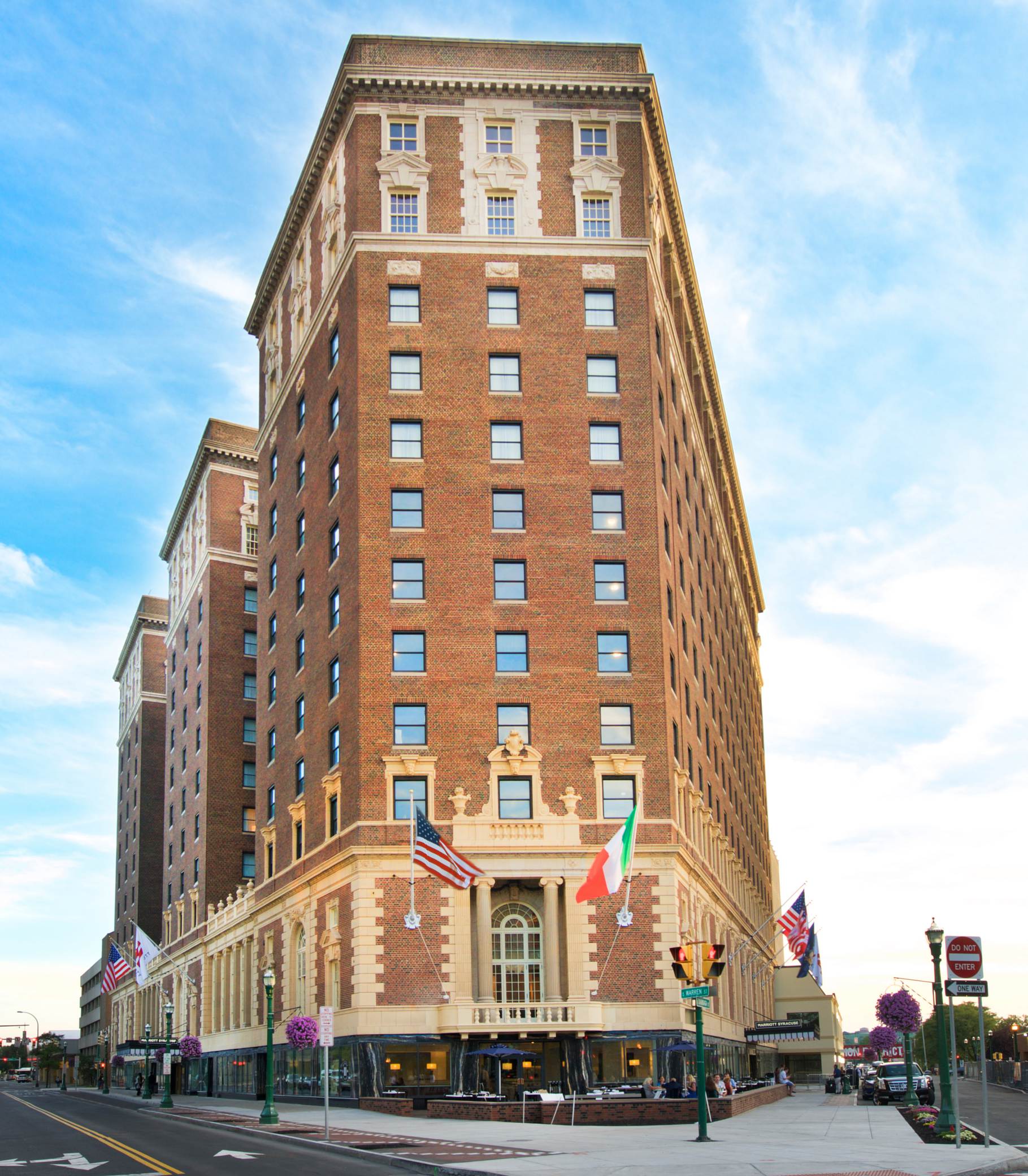 a large brick building with flags on the side