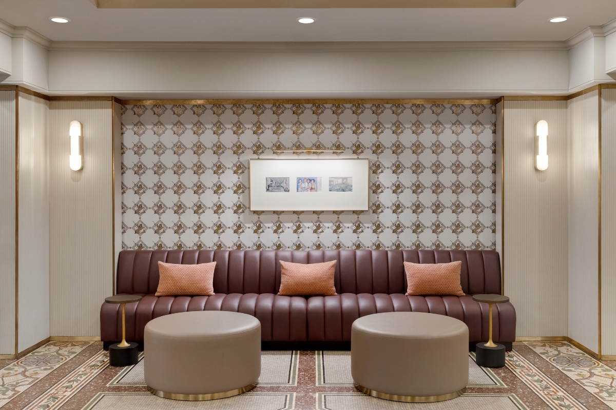 a couch and stools in a room