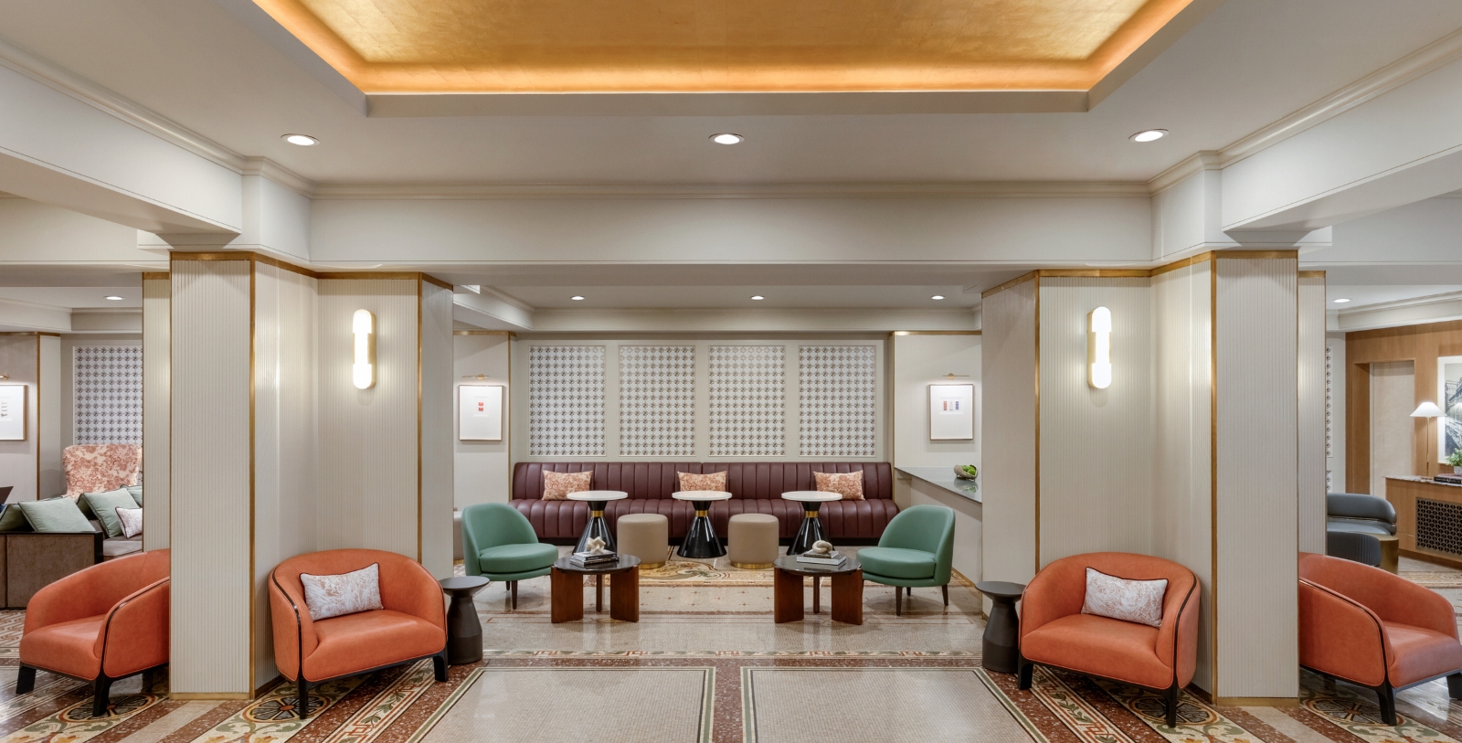 a room with a couch and chairs