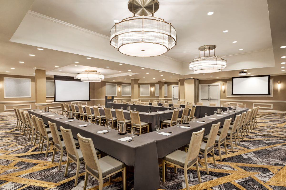 a large conference room with a large table and chairs