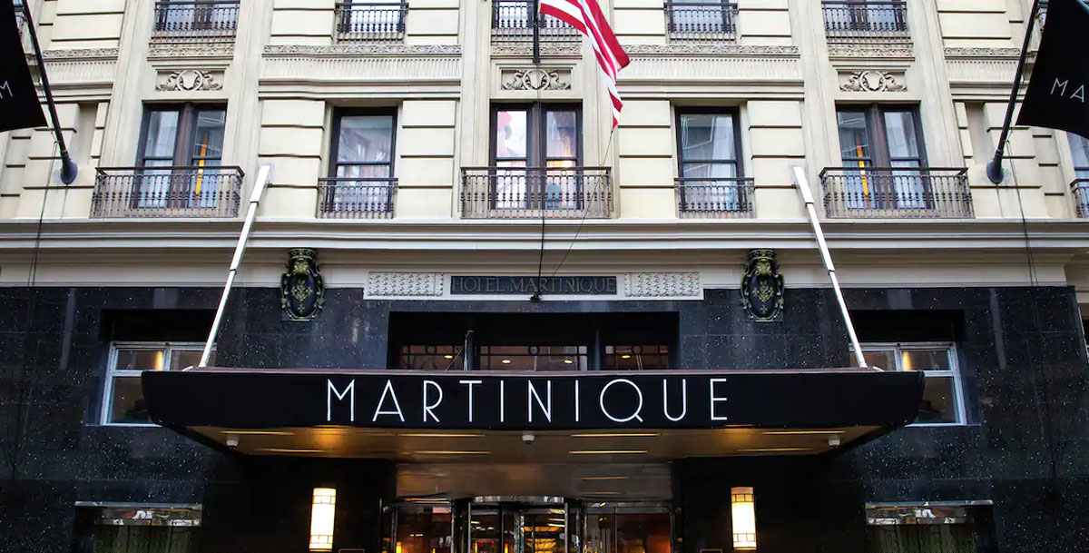 a flag flying in front of a building