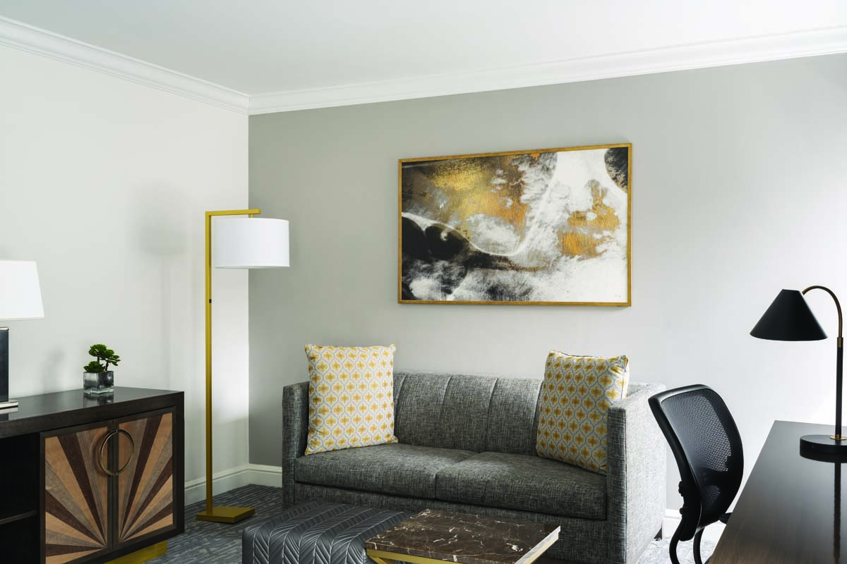 a couch and a painting on the wall
