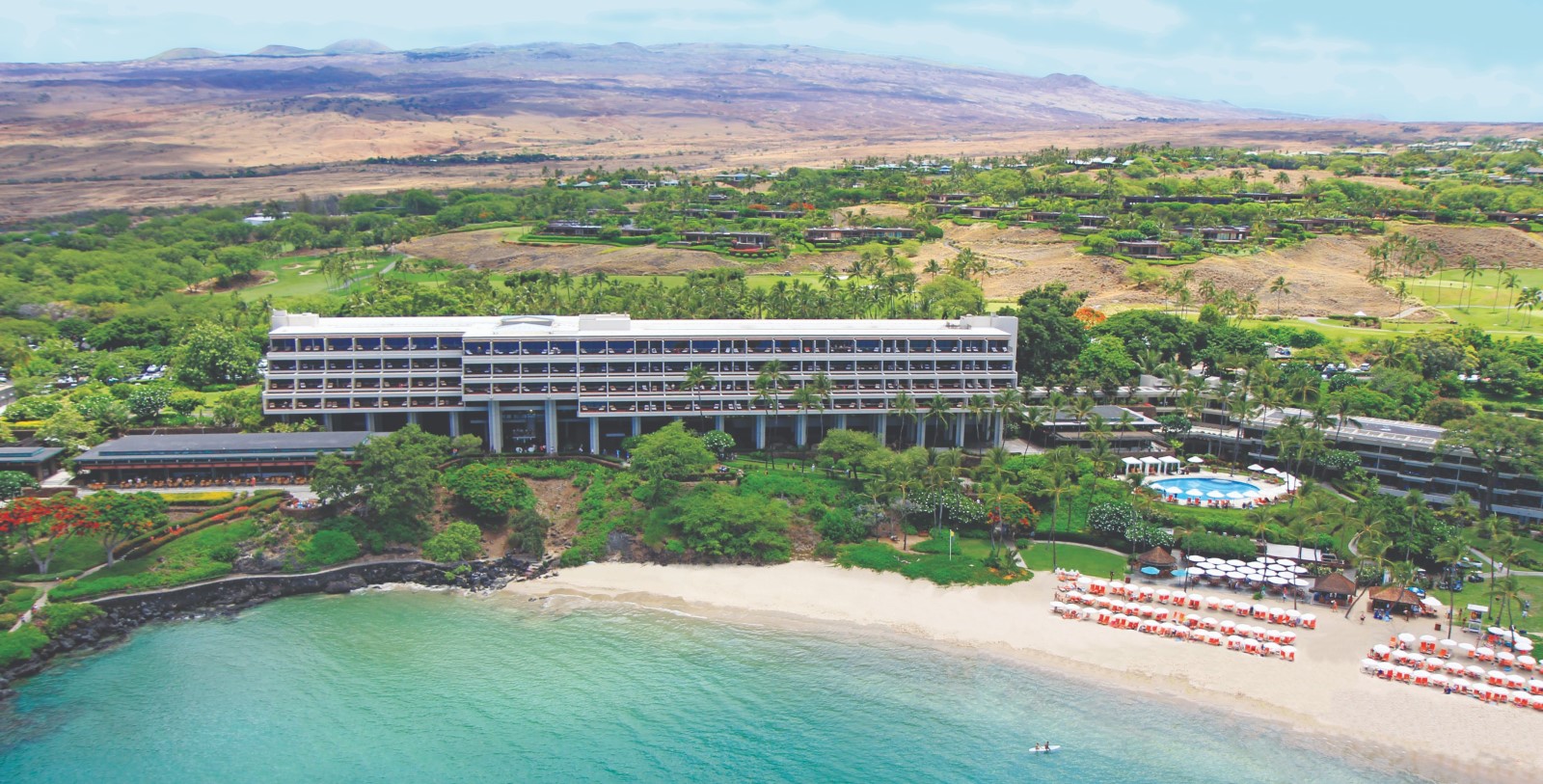 a large building on a beach