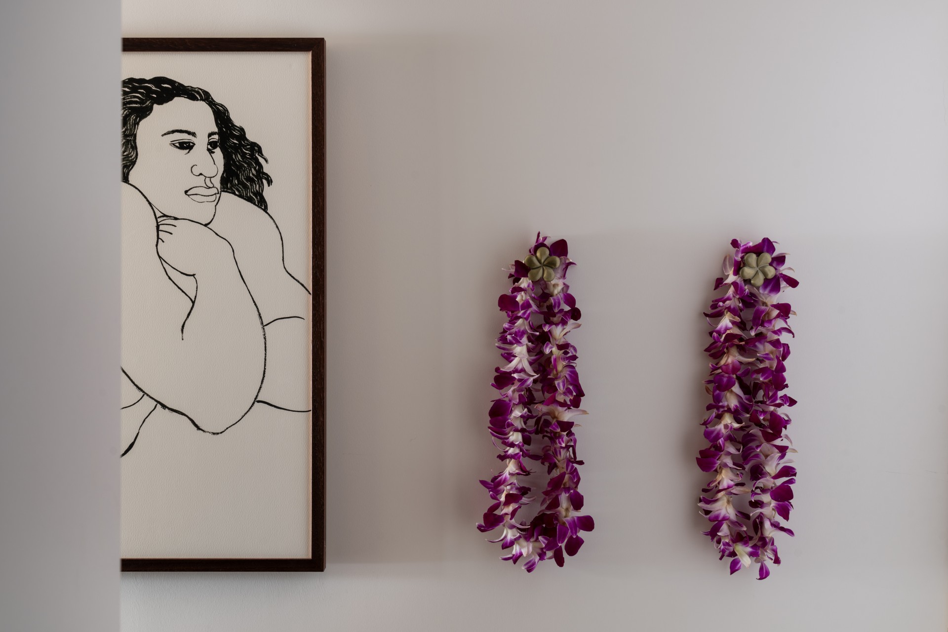 a framed picture of a woman and purple flowers