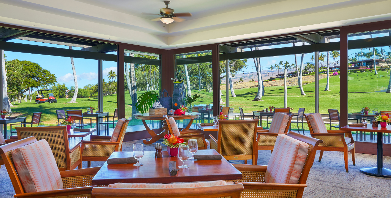 a room with a table and chairs and a pool