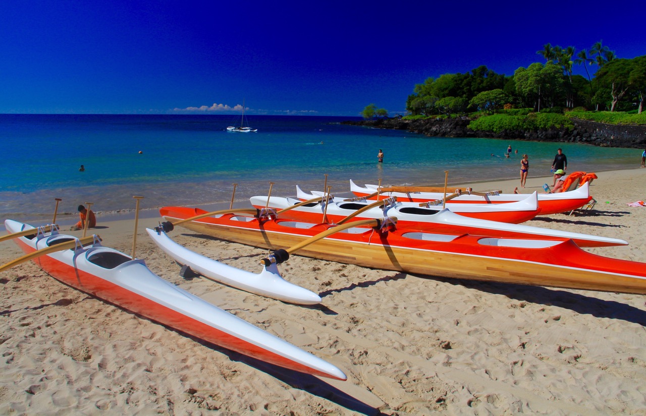 a group of boats on a beach