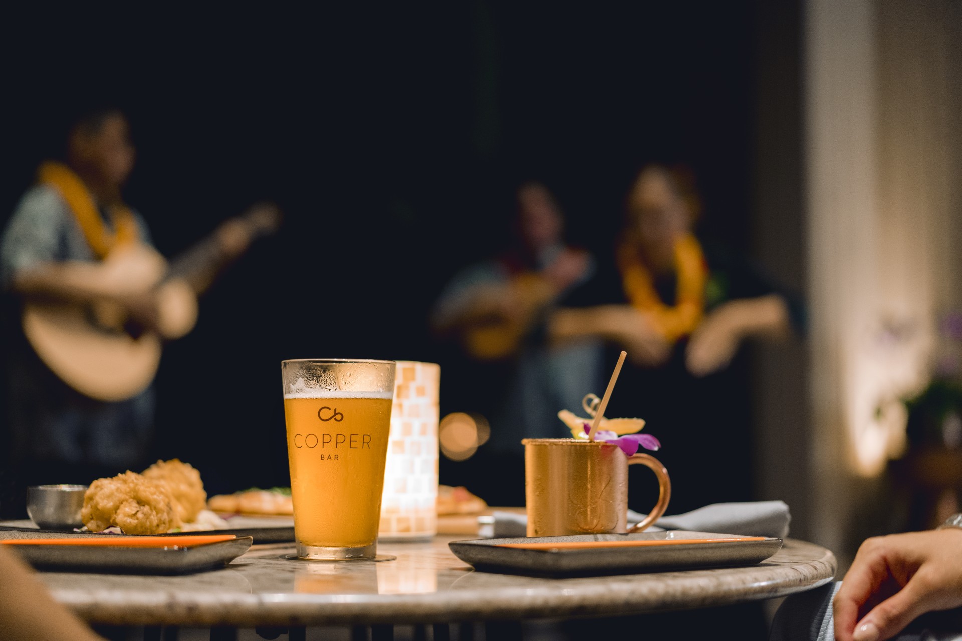 a table with a drink and a cup on it