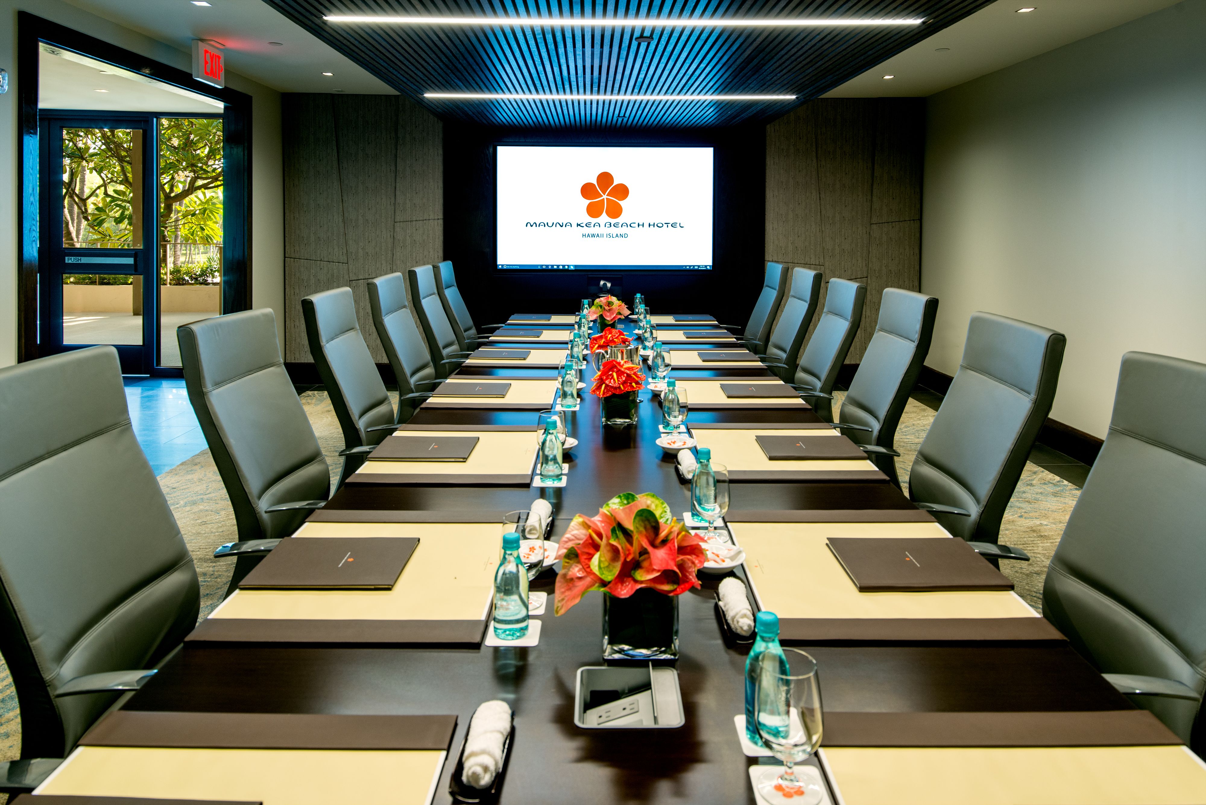a conference room with a large screen