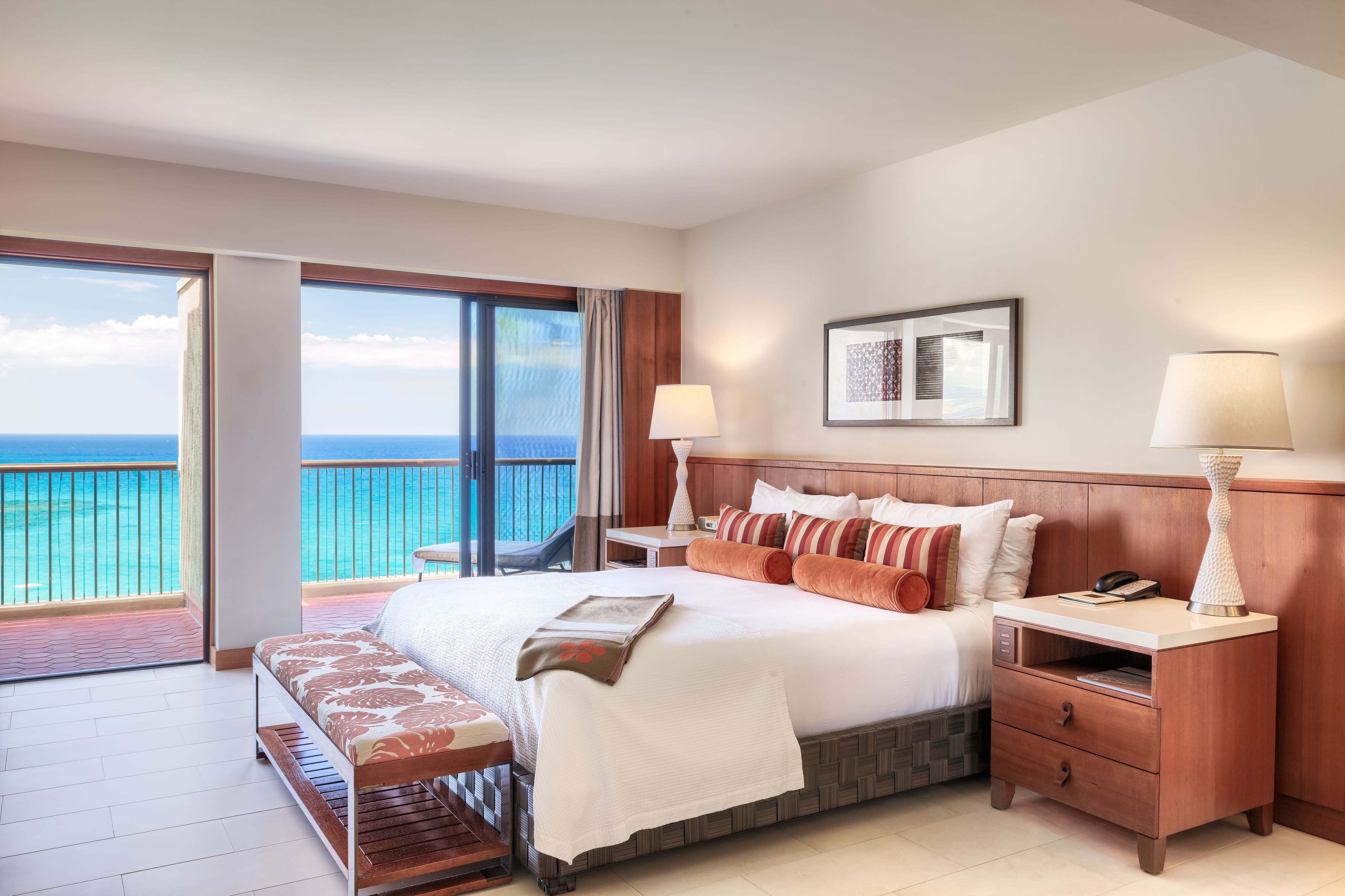 a bedroom with a view of the ocean