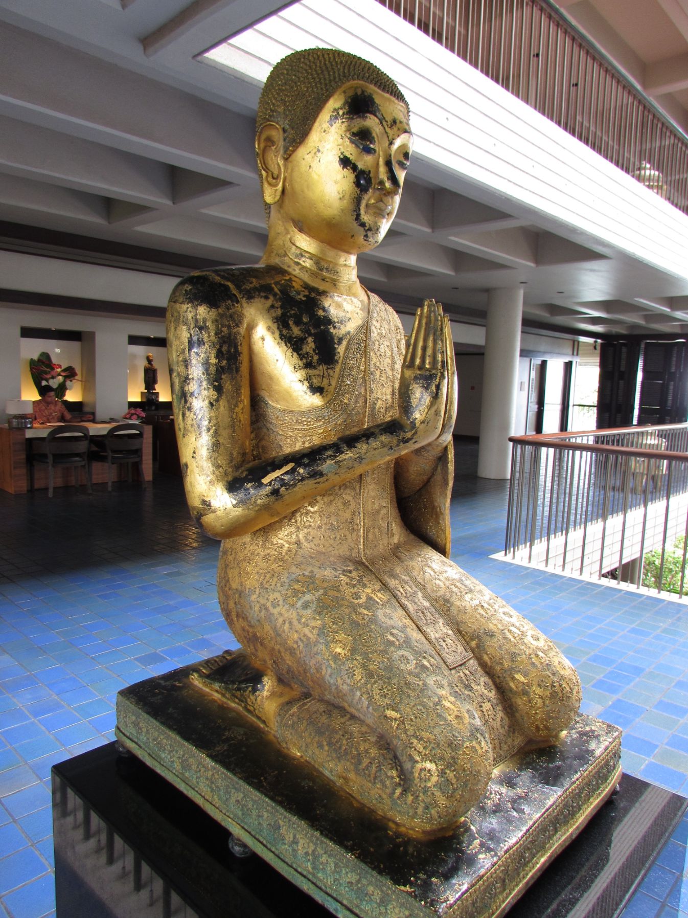 a statue of a person praying