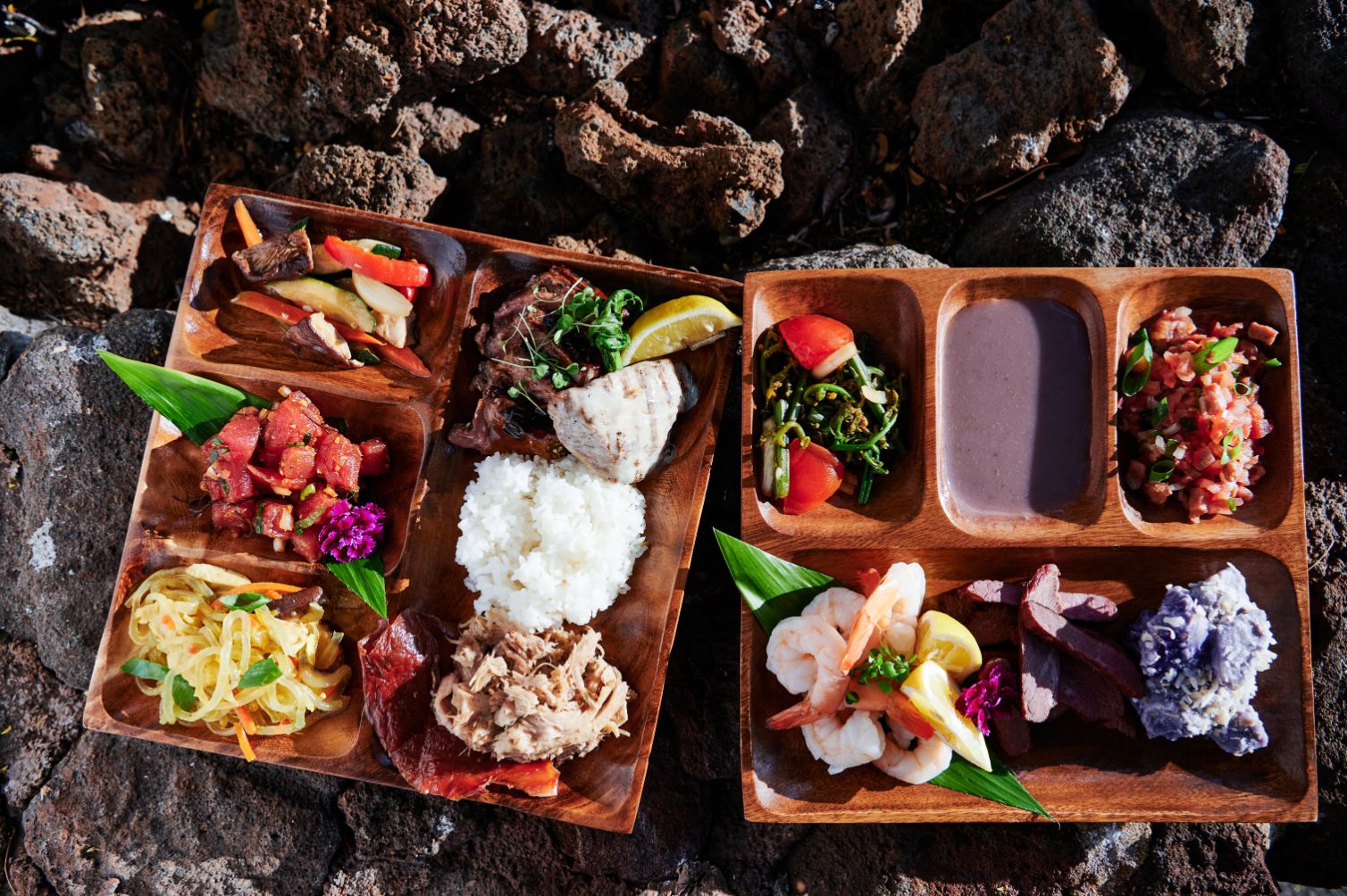 a tray of food on rocks
