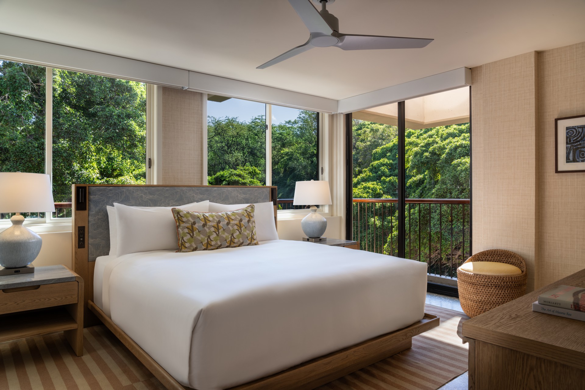 a bedroom with a bed and a fan