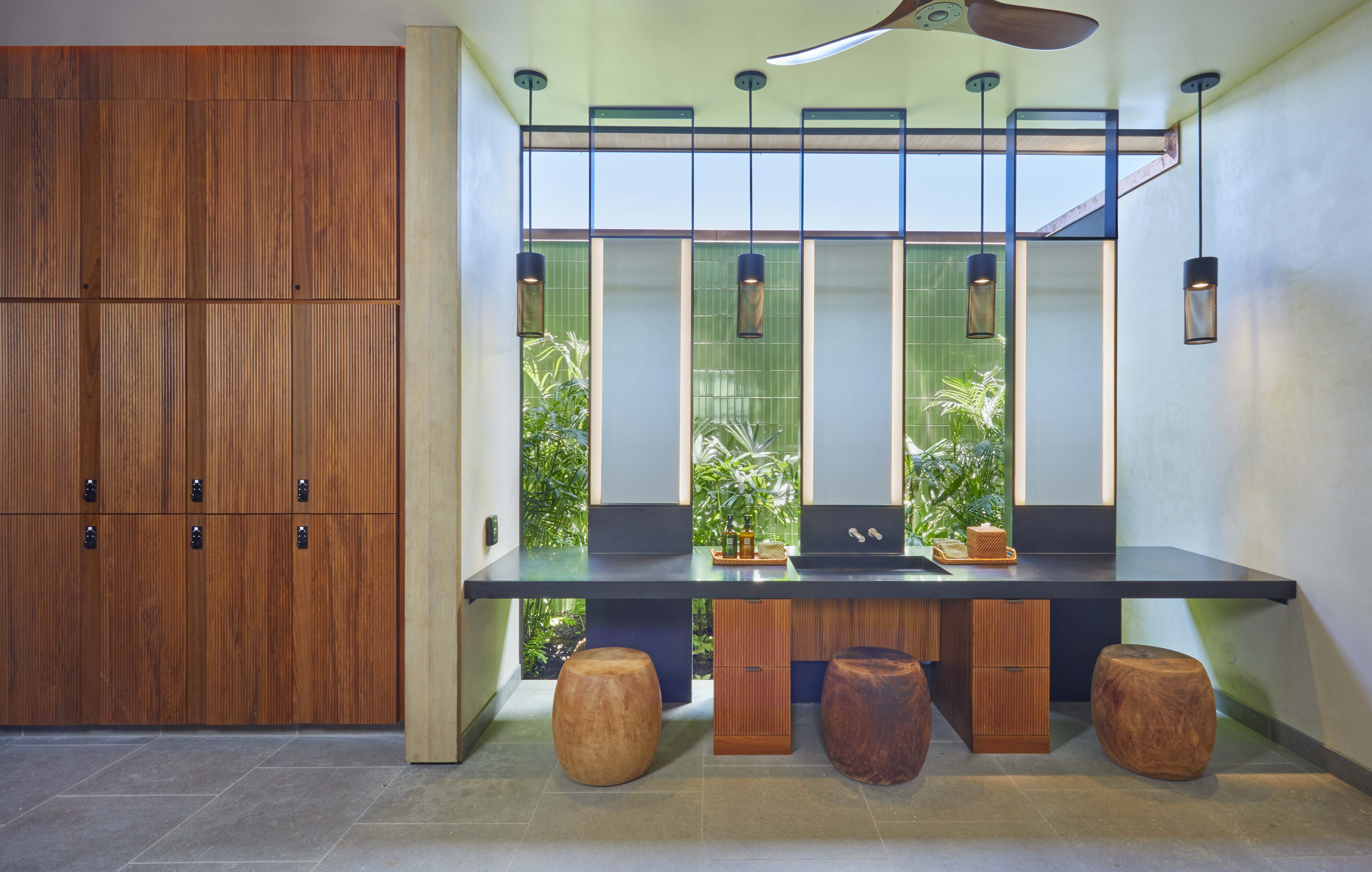 a bathroom with a sink and stools