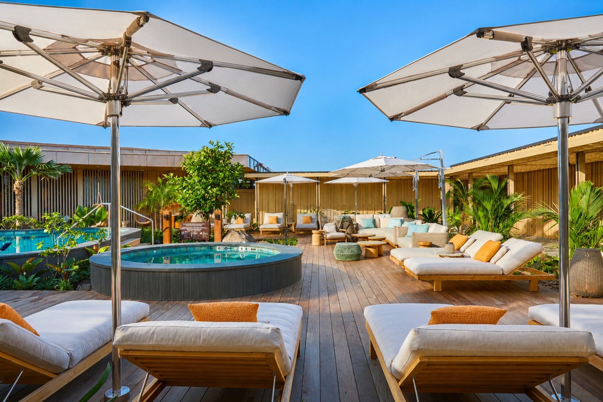 a patio with umbrellas and chairs