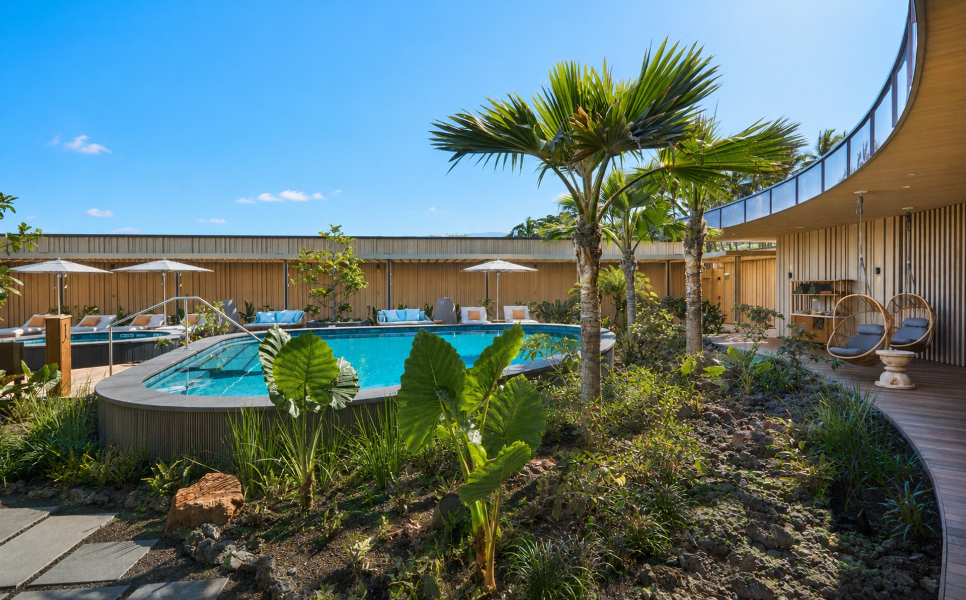 a pool with palm trees and umbrellas