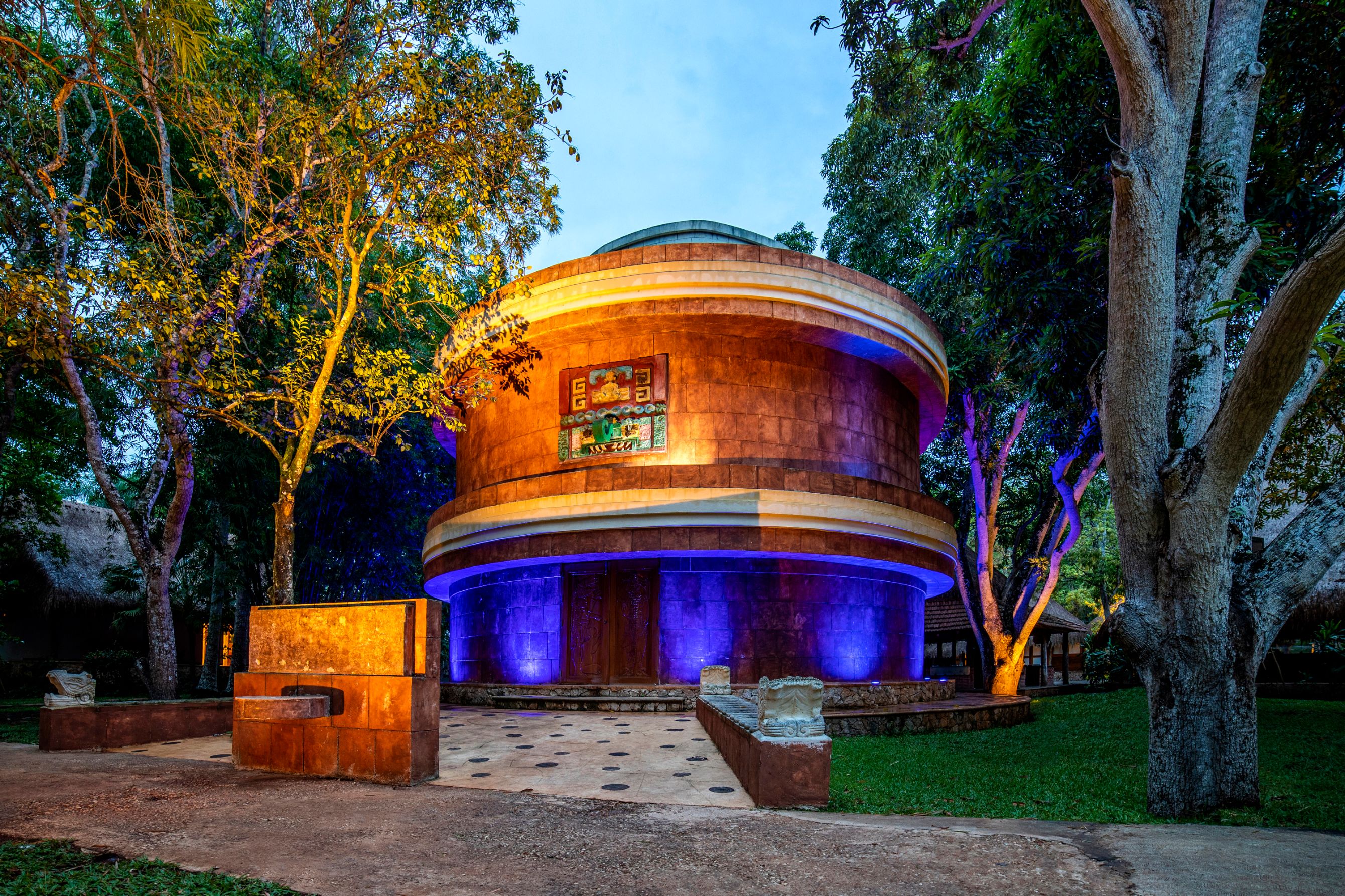 a circular building with purple lights