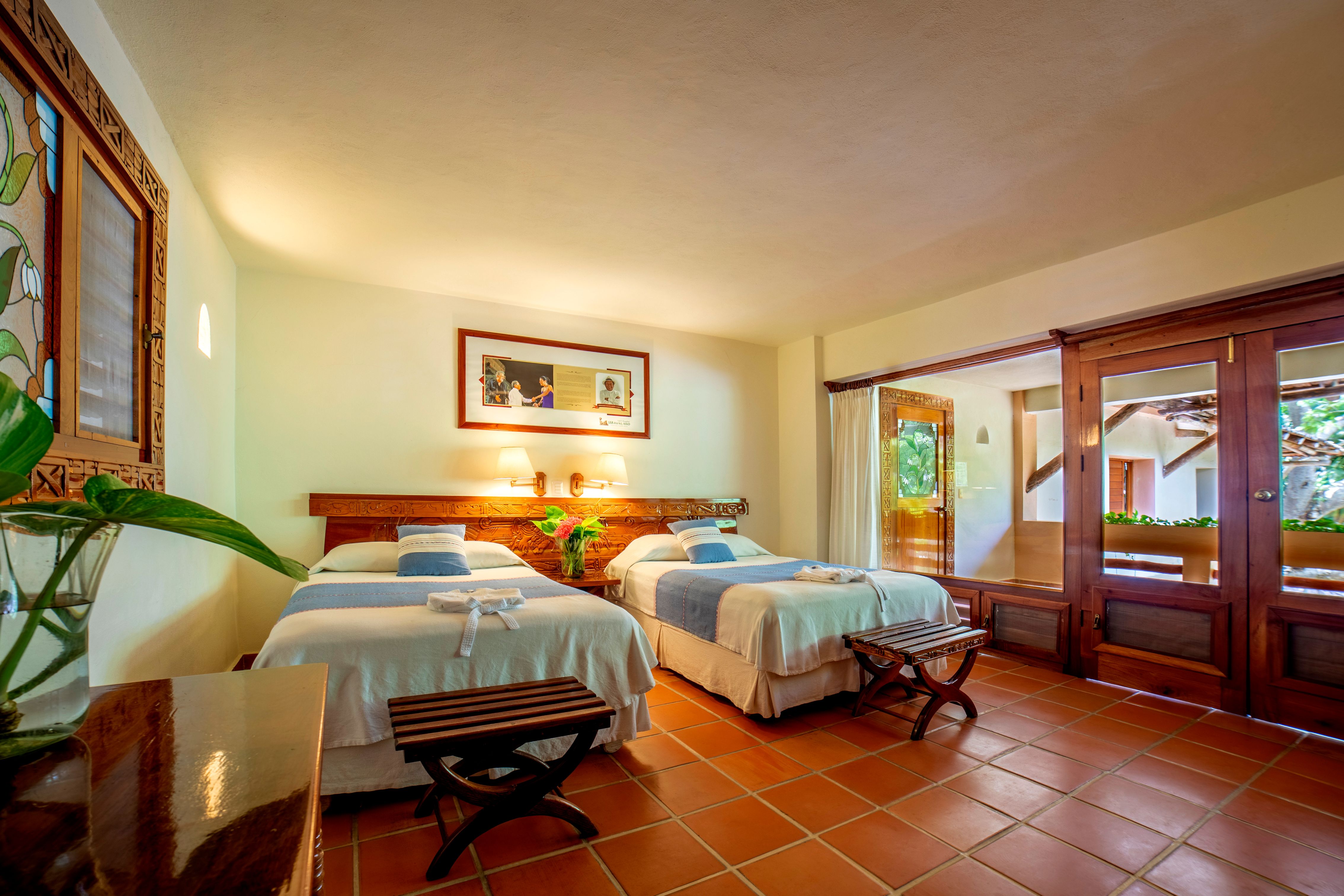 a room with two beds and a door