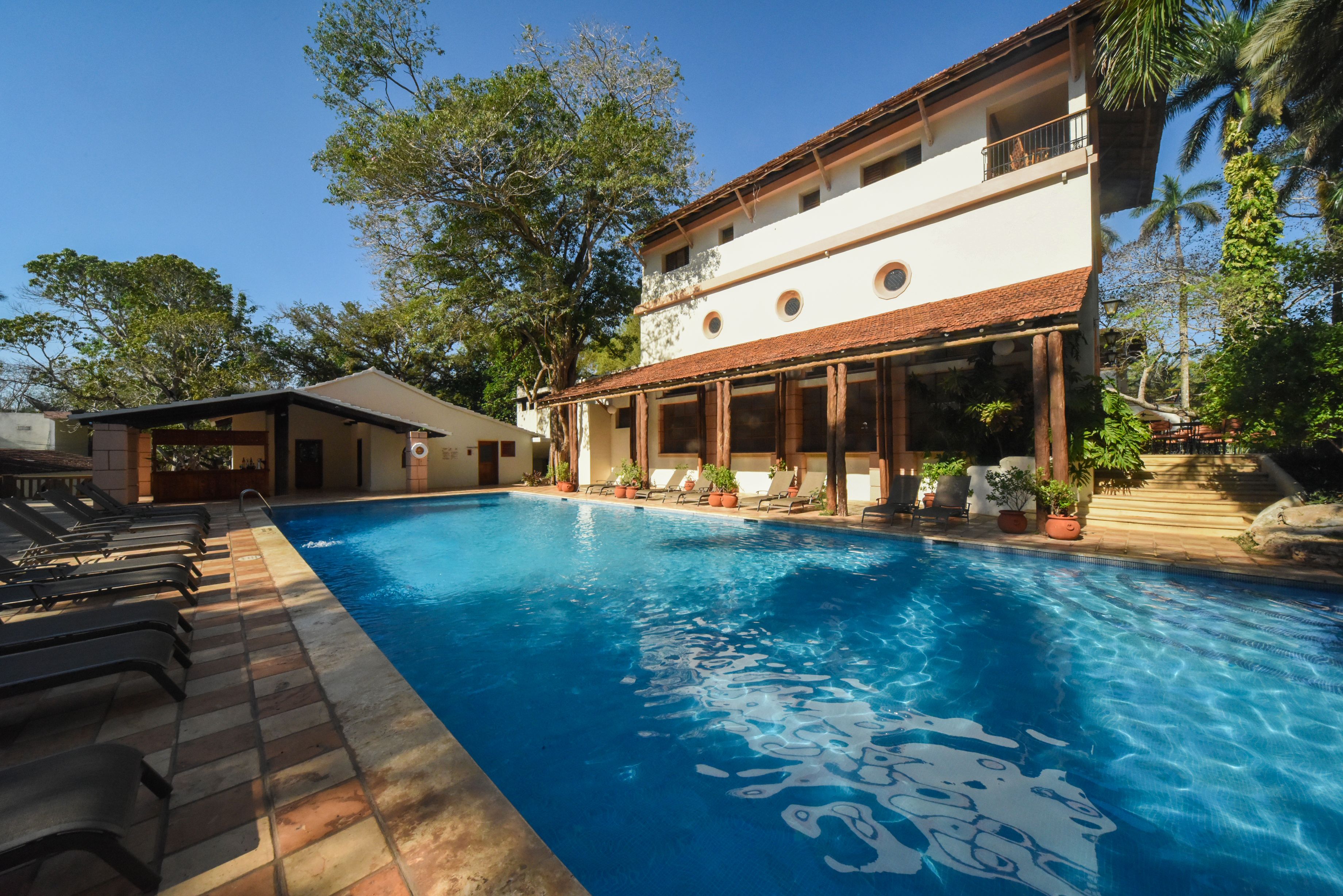 a swimming pool in front of a building